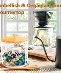 Clear Coffee Pod Holder With Bamboo Lid 80 Ounce K Cup Organizer For Countertop Pods And Filter Holder To Keep Pods Neat Easy Grip Handle Durable Kitchen Accessory on countertop with coffee accessories.