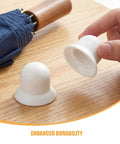 Upgrade Your Shade Game With Sturdy White Patio Umbrella Pole End Cap Replacement Kit Featuring Quick Tool-Free Install, Wind Resistance And Scratch Protection For Beach Tents And Garden Canopies. White plastic umbrella pole end cap shown in hand, one on table.