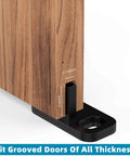 Sliding door with eight piece barn door floor guides set for sliding doors bottom mount floor track and closet hardware black finish.