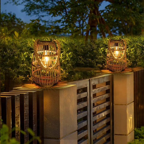 Outdoor Solar Rattan Lantern With Handle For Hanging Or Table Use, Cozy Chill Edison Bulb Glow on garden wall at night