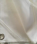 Close-up of heavy duty canvas fabric with grommets, 58 By 58 Inch Golf Target Cloth For Indoor And Outdoor Practice, High Visibility White Backdrop.