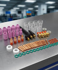 Nishiyuenyi 71 Pc Industrial Tig Consumables Kit includes purple nozzles, ceramic cups, collets, and sealing rings on a workshop table.