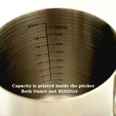 Interior of Pro Grade Milk Frothing Pitcher With Precision Pour Spout 21 Ounce Steaming Jug With Thermometer Pen Stainless Steel Milk Steam Cup showing capacity markings.