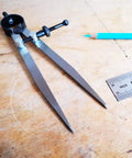 Heavy Gauge Adjustable Wing Divider Locking Steel Compass Six Inch Legs Bullseye Accurate Layout Scribe for crafting and measuring.