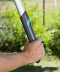 Close-up of hands holding Heavy-Duty Tree Loppers With Steel Blade And 35.5 Inch Handle, Telescoping TeleCut 650-900 B Pruner.