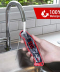 Waterproof Digital Meat Thermometer With Ambidextrous Backlit Display being rinsed under running water in kitchen sink