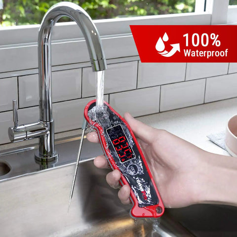 Waterproof Digital Meat Thermometer With Ambidextrous Backlit Display being rinsed under running water in kitchen sink