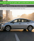 Universal 43.3 Inch Black Roof Rack Cross Bars for SUVs and Crossovers with measurement guide on a sedan in cityscape