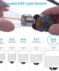 Person screwing E26 bulb into socket for 24 Ft Outdoor Hanging String Lights With 12 Vintage S14 LED Bulbs Heavy Duty 120V Plug In Connectable