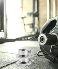 2 Pack Barbell Collar Screw Clamps No Slip Dumbbell Weight Clamps Steel Lock Nuts on a barbell in a home gym setting