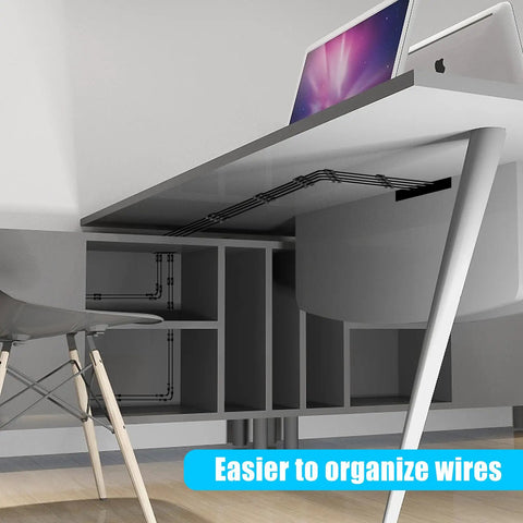 Black cable clips managing wires under a desk, demonstrating cable organization with 50 Pack Medium Self Adhesive Cable Clips Black For Under Desk Car Wall TV PC Ethernet Cables Cable Management And Cord Organizer Holder With Strong 3M Adhesive Nylon.