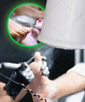Top Tier Nail Dust Collector Machine With Integrated Lamp And Badass Suction Fan For Manicurists And Home Salon Crews Offering Ten Adjustable Speeds And Ultra Quiet Operation For Crisp Filings in use while filing nails.