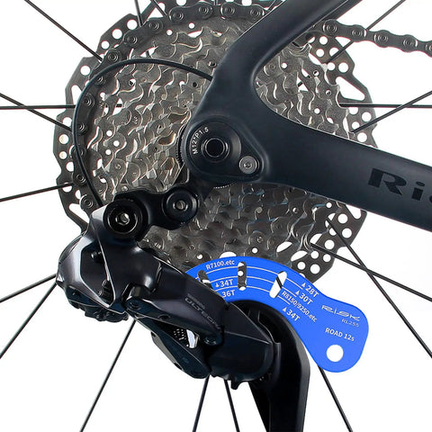 12 Speed Di2 Derailleur Adjustment Tool 2 Pack for Road Bikes Electronic Shifters With Precise Tuning Gauge attached to wheel