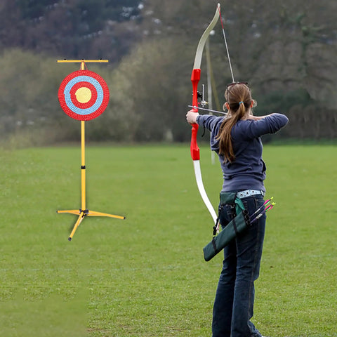 Archer aiming at target on Adjustable Foldable Metal Tripod Archery Target Stand For Backyard And Shooting Range Bow And Arrow