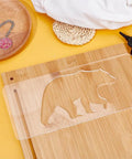 Clear Acrylic Bear Router Template 12X5 Inch on wood surface for seamless inlay work and DIY projects.