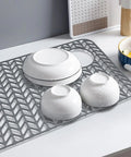 Sink Protector Mat 28.6 x 14.5 Inches, Heat-Resistant Silicone Folding Non-Slip Pad with bowls on kitchen counter