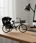 Vintage Metal Tricycle Model With Heavy Duty Aluminum Alloy Build And Old School Three Wheel Rickshaw Design on a desk.