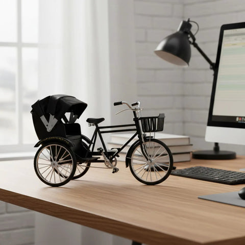 Vintage Metal Tricycle Model With Heavy Duty Aluminum Alloy Build And Old School Three Wheel Rickshaw Design on a desk.