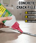 Heavy Hitter Concrete Crack Filler Water Based Sealer applied to a crack in tile, showcasing ease of use and smooth application.