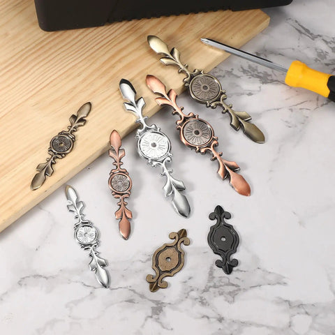 4 Pack Cabinet Backplates Dope Bronze Zinc Alloy Retro Vintage Style for Wardrobes, Cupboards, Closets, and Dressers displayed on marble.