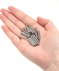 Hand holding 304 Stainless Steel Dowel Pins 3x20mm Round Head Flat Chamfered End 50 Pack for woodworking and furniture use