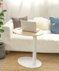 Adjustable Height Rolling Laptop Stand With Spacious Work Surface Smooth Caster Wheels Portable Computer Desk For Bedroom Living Room And Home Office Kick Back Ready Workstation next to a sofa with a laptop on top.