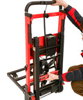 Heavy Duty Electric Hand Truck With 441 Lb Capacity And 160W Motor, user adjusting the handle on a red motorized climbing dolly.