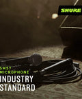 SM57 Dynamic Microphone For Guitar Amps, Snare Drums, Percussion, Brass And Live Sound Or Studio Sessions displayed with cable