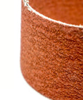 Close-up of Heavy Duty 2 By 36 Ceramic Sanding Belts For Grinding Deburring And Metal Finishing With 120 Grit Cloth Backing.
