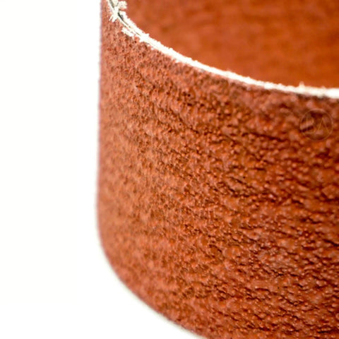 Close-up of Heavy Duty 2 By 36 Ceramic Sanding Belts For Grinding Deburring And Metal Finishing With 120 Grit Cloth Backing.