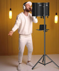 Person recording with Pro Grade Studio Microphone Isolation Shield With Pop Filter And High Density Foam, Adjustable Stand, Metal Adapters