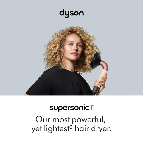 Woman using Supersonic Hair Dryer In Ceramic Pink And Rose Gold For Ultrafast Drying Lightweight Ergonomic Design With No Heat Damage