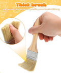 Ergonomic Thick Wood Handle Flat Paint Brush Set Of 30 Pieces Two Inch Wide Heads For Oil And Latex Paints Dope held in hand