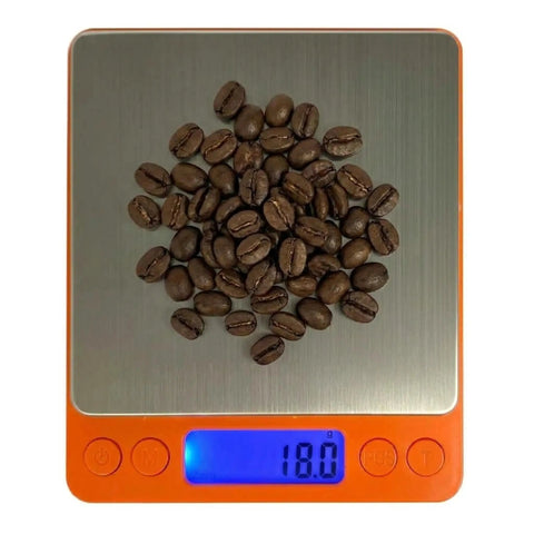 Barista Grade 0.1G Precision Coffee Scale For Espresso And Pour Over With 3000G Capacity Pocket Size On The Go LCD Display And Tare Function Batteries Included Perfect For Accurate Brews At Home, showing coffee beans on display.
