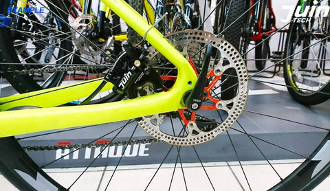 Cable Actuated Hydraulic Disc Brake Caliper Set For Flat Mount Road Gravel And CX Bikes on rear wheel close-up