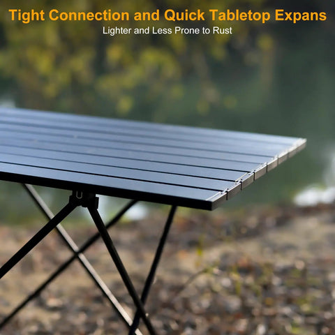 Ultralight Foldable Camping Side Table With Aluminum Build in outdoor setting, close-up of tabletop and X-shaped legs.