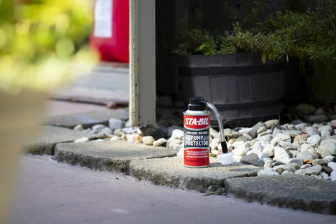 Pump Protector For Pressure Washer Storage With Next Gen Anti Freeze And Lubricant Formula 4 Oz placed on outdoor patio