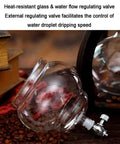 Portable Cold Brew Drip Tower With Smooth Flow Dial And Hefty 1000 Milliliter Pitcher showing heat-resistant glass and water flow regulating valve.