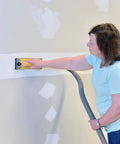 Person using Dust Free Drywall Vacuum Hand Sander With Six Foot Hose For Any Wet Dry Vacuum Easy Clamp Sanding Screen Replacement.