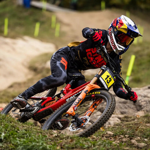 Mountain biker cornering on trail with Forekaster 29x2.40WT Tubeless-Ready MTB Tire with 3C MaxxTerra EXO+ Protection