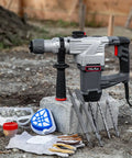 Electric SDS-Plus Rotary Demolition Hammer 1180W with 1-1/4 inch bit capacity, kit with chisels, drill bits, goggles, and case outdoors