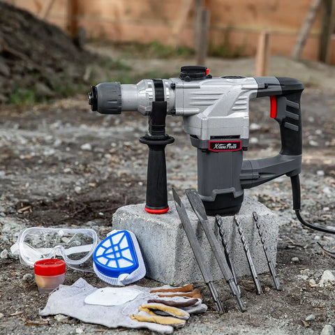 Electric SDS-Plus Rotary Demolition Hammer 1180W with 1-1/4 inch bit capacity, kit with chisels, drill bits, goggles, and case outdoors