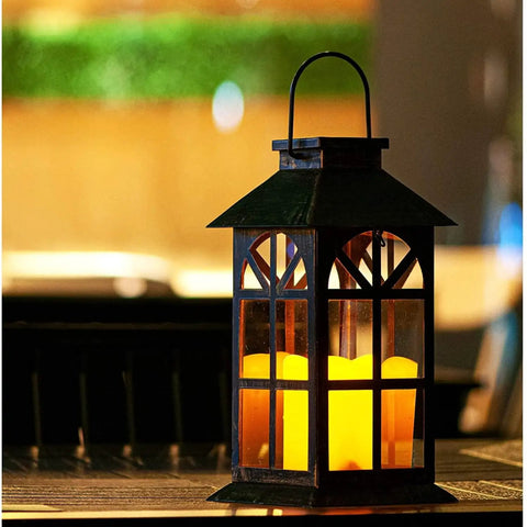 Bronze Hanging Solar Lanterns Two Pack Outdoor Waterproof Decorative Lanterns with cozy flickering LED candles in dark setting.