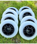 Dope Inline Skate Wheels 84mm 85A 8 Pack With Bearings For Indoor Outdoor Use Durable PU Replacement Rollers arranged on grass