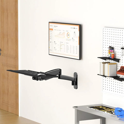 Sleek Wall Mounted Keyboard Tray 26 Inch Heavy Duty Steel Platform With Dedicated Mouse Nook Raised Edge Guard Adjustable Tilt Angle Black installed on wall.