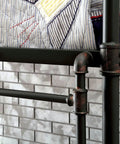 Close-up of Twin Over Twin Metal Bunk Bed With Attached Ladder Full Pipe Frame Upper Guard Rails Antique Black Finish Built Tough