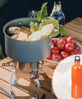 Cooking setup with vegetables on a camping stove, Aluminum Fuel Bottle 750ml For Camping And Outdoor Use in inset circle
