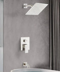 Slick Brushed Nickel Shower Faucet Wall Mount Set with Rainfall Shower Head, Tub Spout, and Handle in Modern Bathroom Setting
