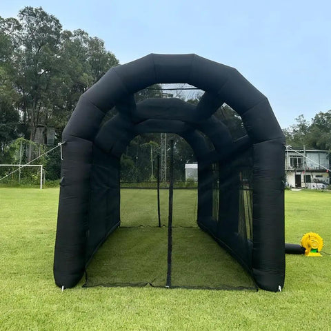 Front view of Inflatable Baseball Hitting Cage With Blower For Backyard Practice, Portable Batting And Pitching Tent, 20Ft L X 10Ft W X 10.5Ft H, Black on grass field.