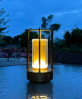 Portable Metal Table Lamp With 4000mAh Rechargeable Battery Cordless Outdoor Light on glass table in evening